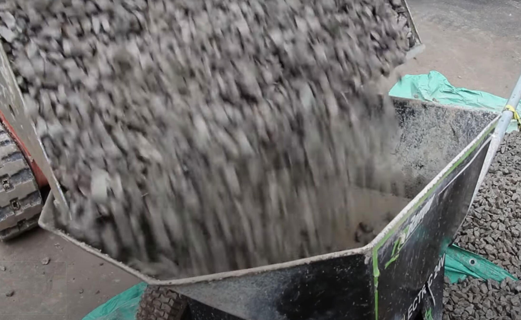 Electric wheelbarrow is loading concrete