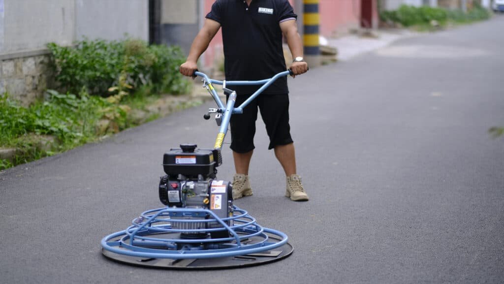 concrete finishing machine working on concrete slab